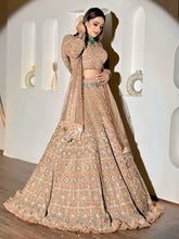 Wedding Collection Beige Color Net Heavy Embroidery Work Lehenga Choli