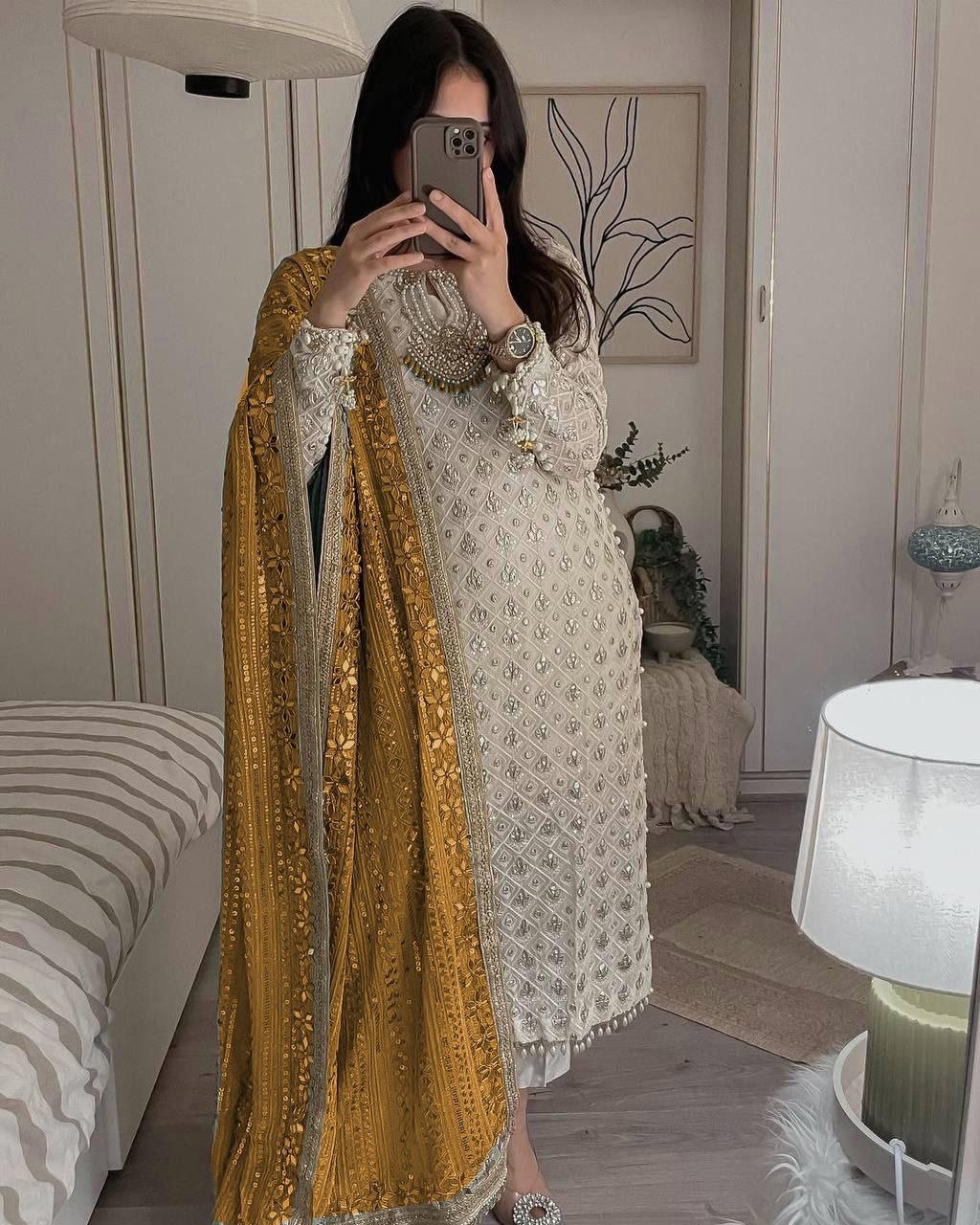 Pretty Sequence Work White Color Suit With Mustard Dupatta