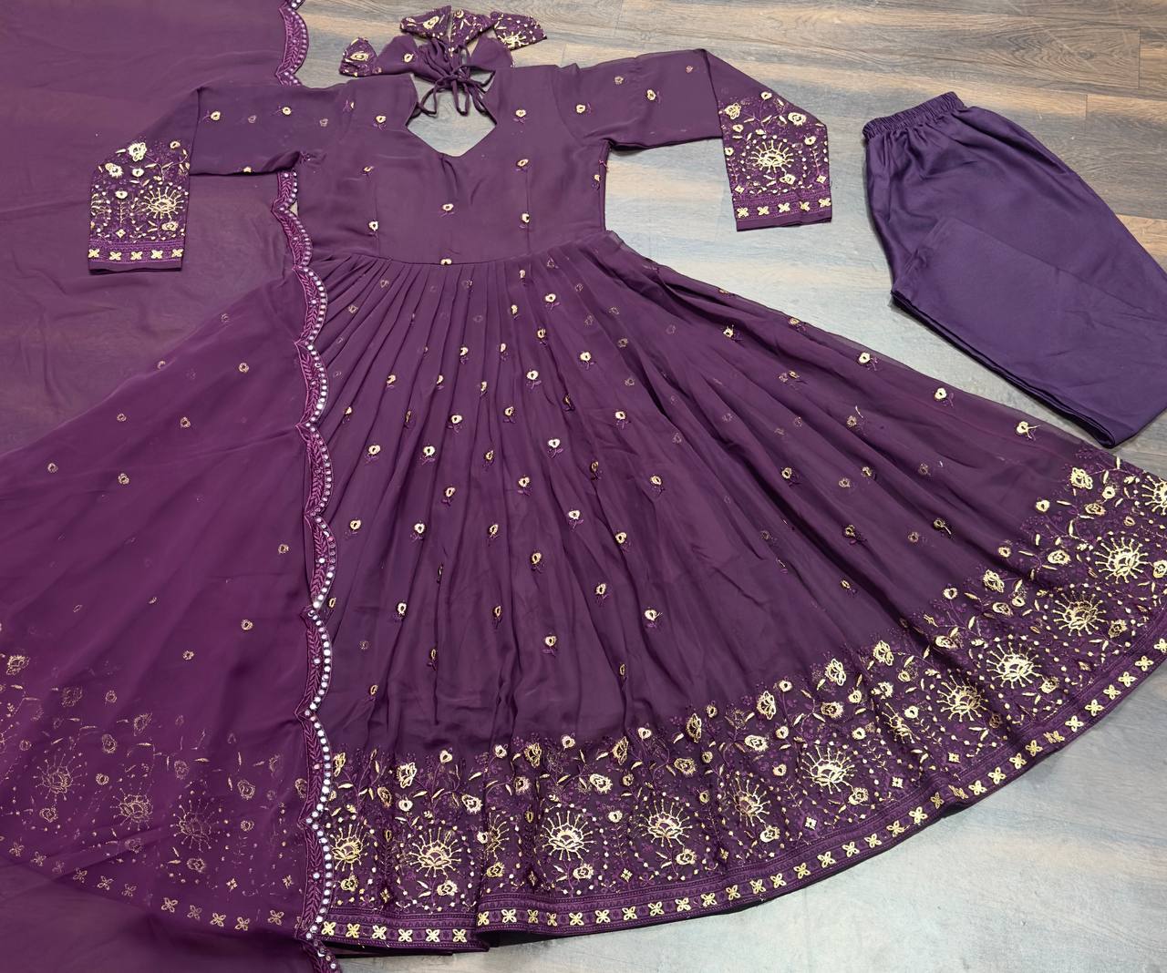 Demanding  Embroidery  Multi Work Purple color long Gown