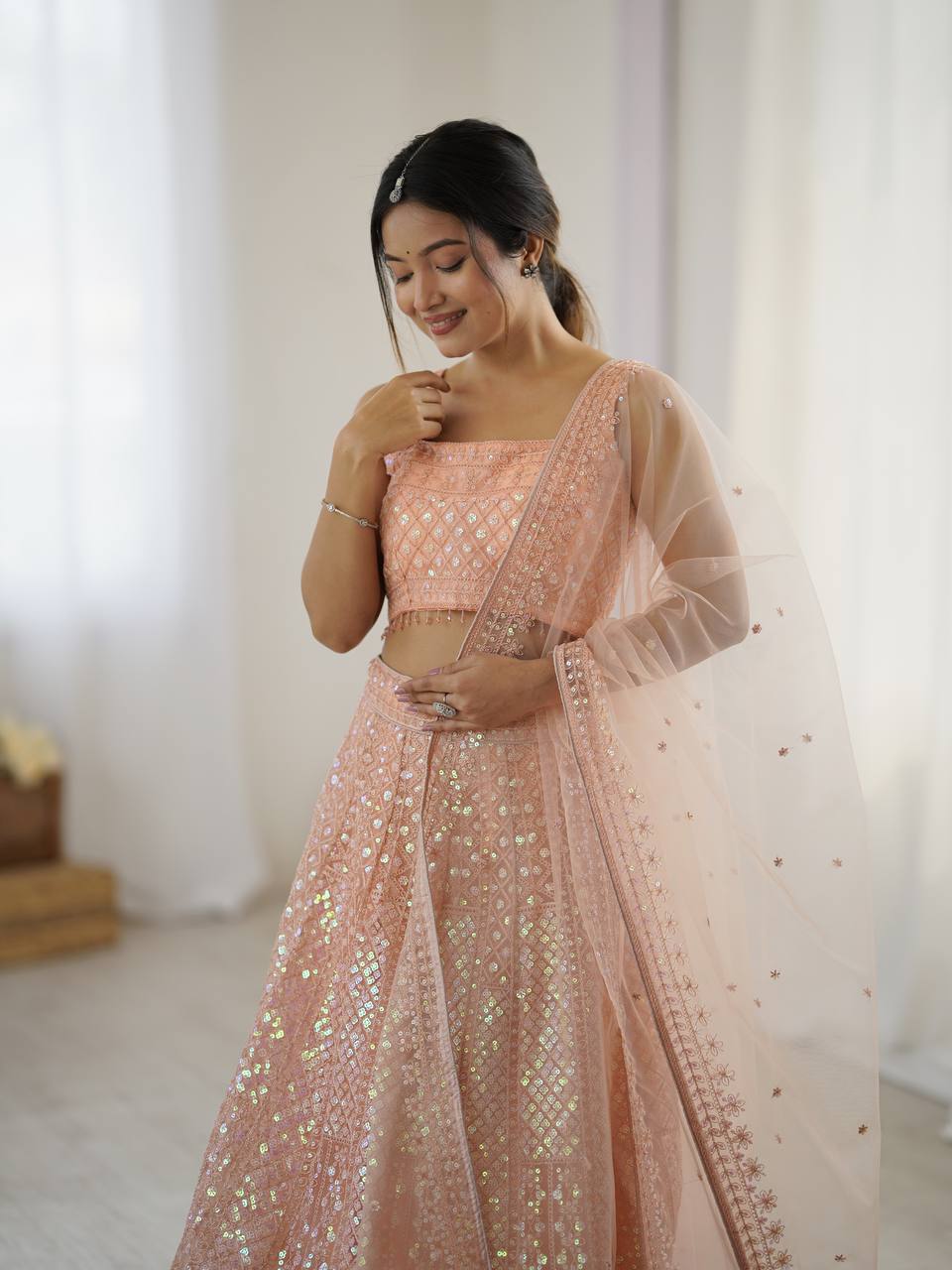 Awesome Peach Net Rainbow Work Lehenga Choli