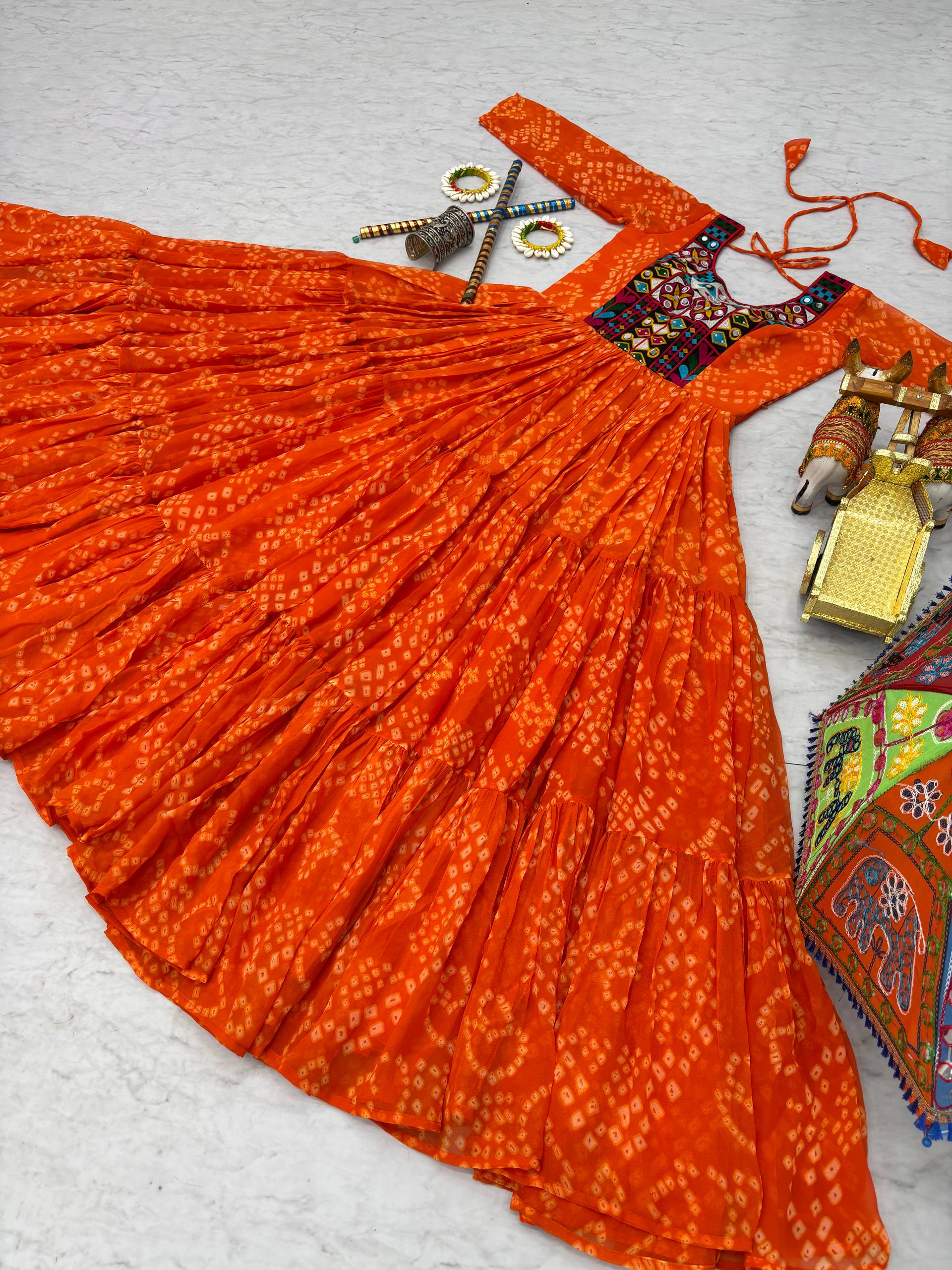 Ravishing Orange Georgette Gamthi Work Gown For Navratri