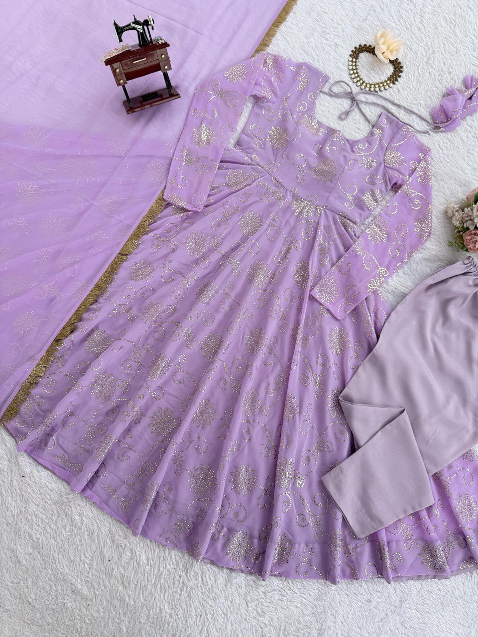 Trendy Lavender Color Georgette Foil Work Gown