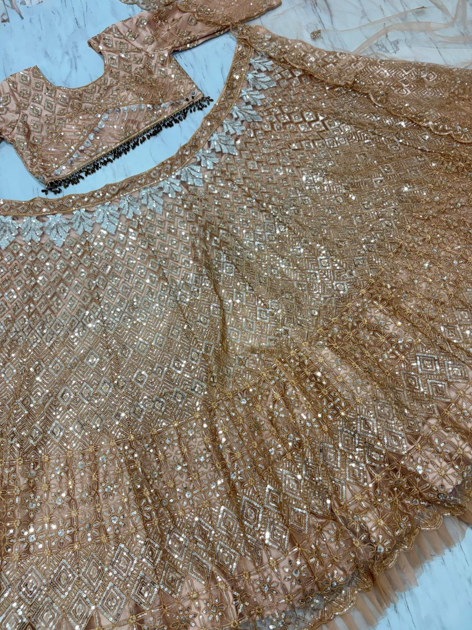 Wedding Collection Beige Color Net Heavy Embroidery Work Lehenga Choli